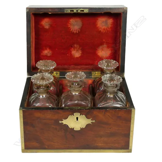 A George III flame mahogany and brass inlay campaign type tantalus,