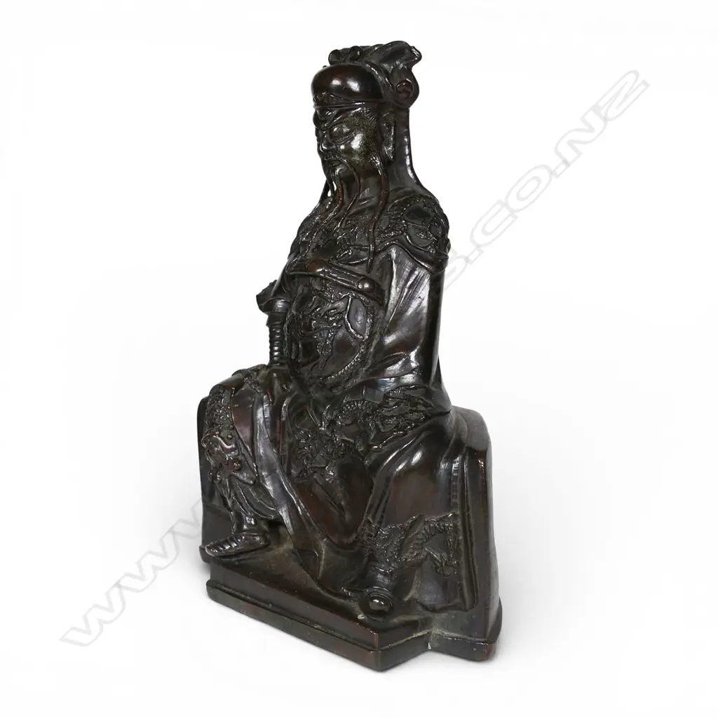 A Chinese reputedly Ming bronze model of a seated and bearded official, Image 1++