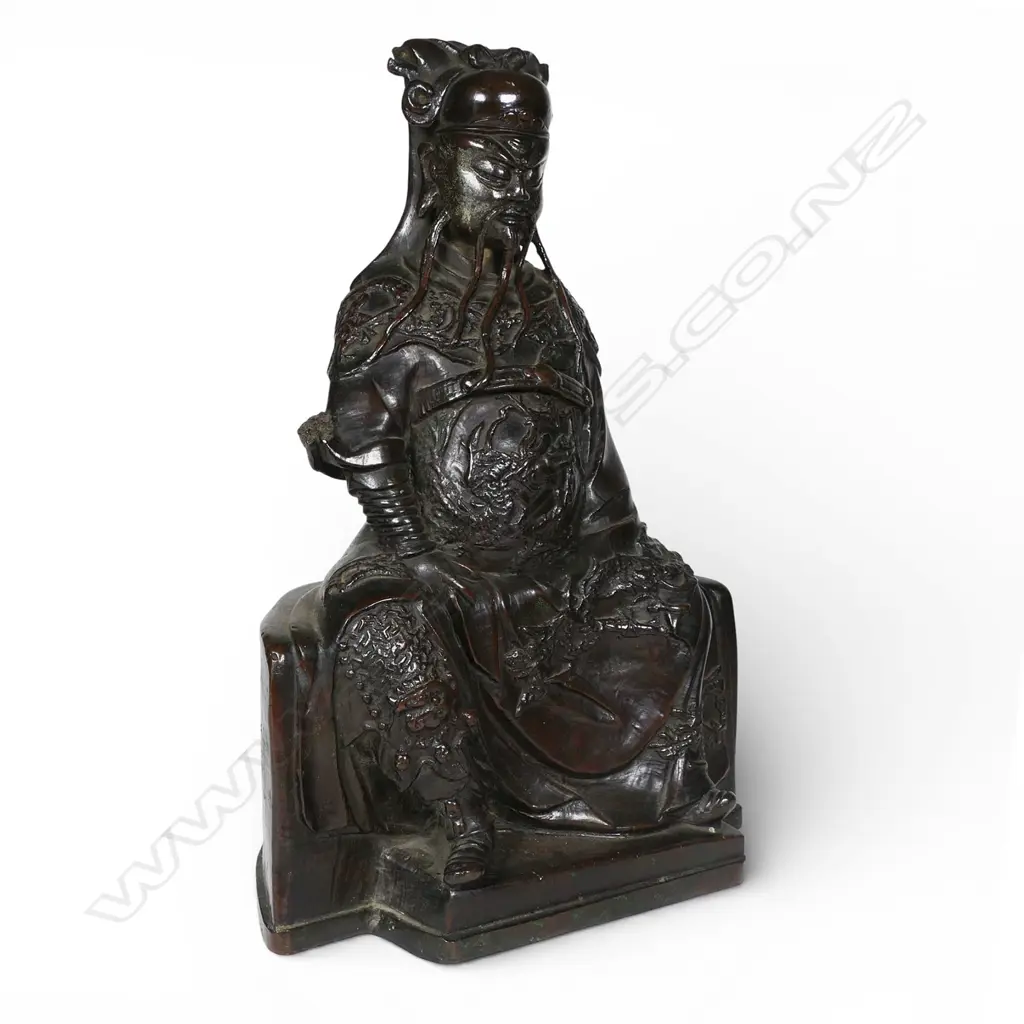 A Chinese reputedly Ming bronze model of a seated and bearded official, Image 1++