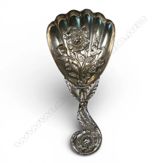 A late Victorian fancy silver embossed caddy spoon,