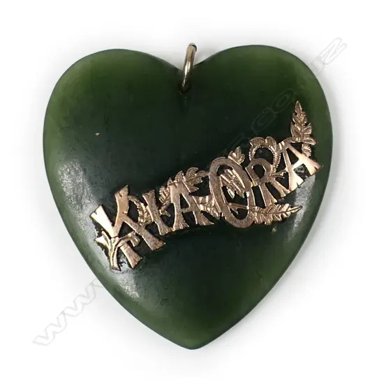 An early 20thC pounamu heart with 9ct gold 'Kia Ora',