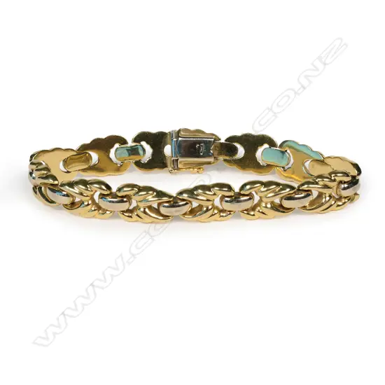 An 18ct two tone yellow and white gold designer link bracelet,