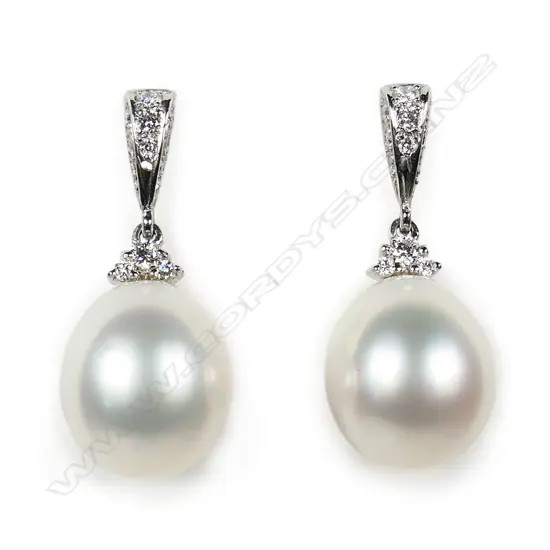A pair of platinum South Sea cultured pearl and diamond drop earrings,