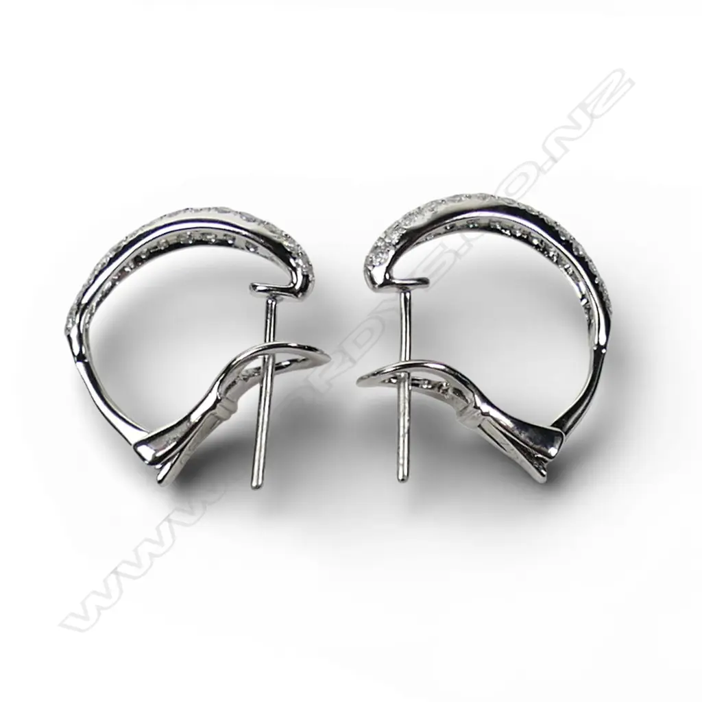 A pair of 18ct white gold and diamond earrings, Image 1++