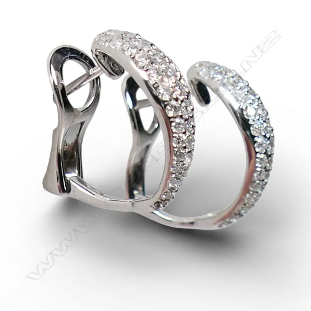 A pair of 18ct white gold and diamond earrings, Image 1++