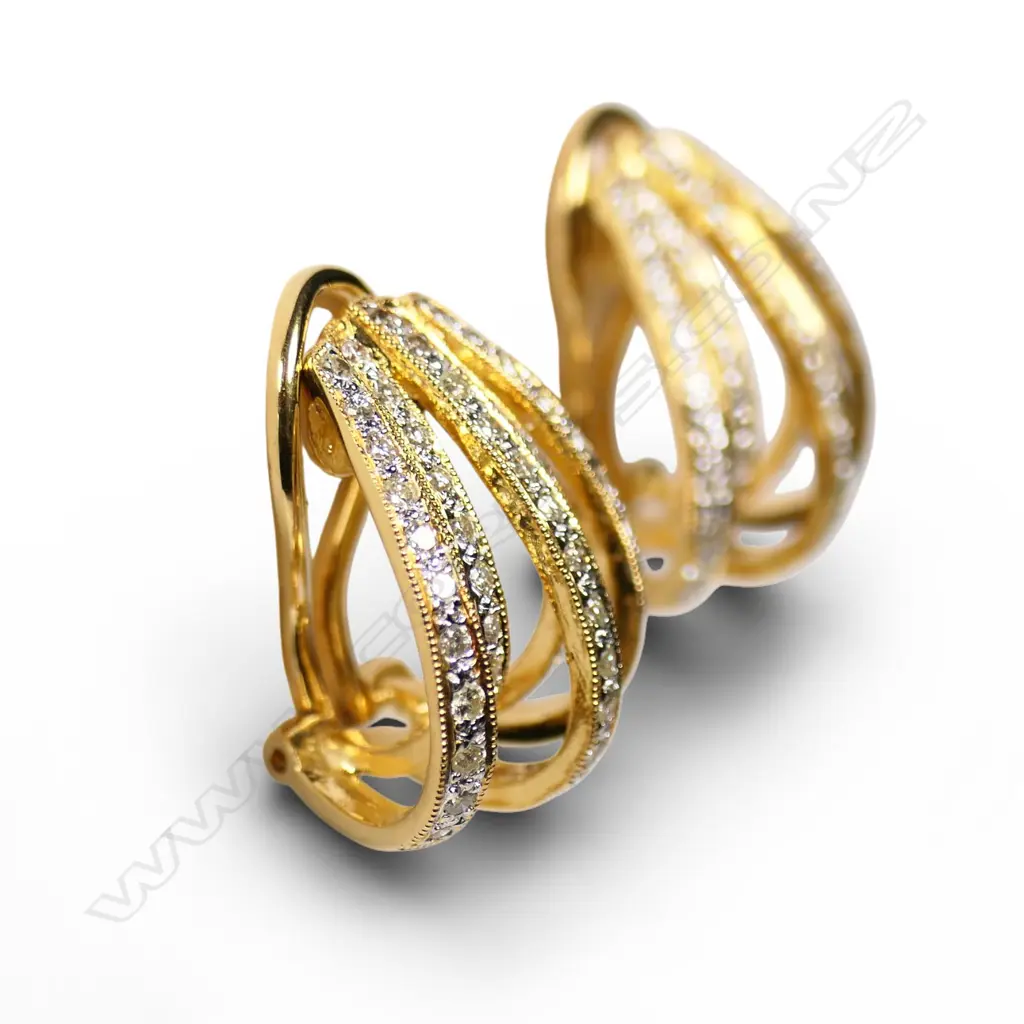 A pair of 18ct gold and diamond earrings, Image 1++