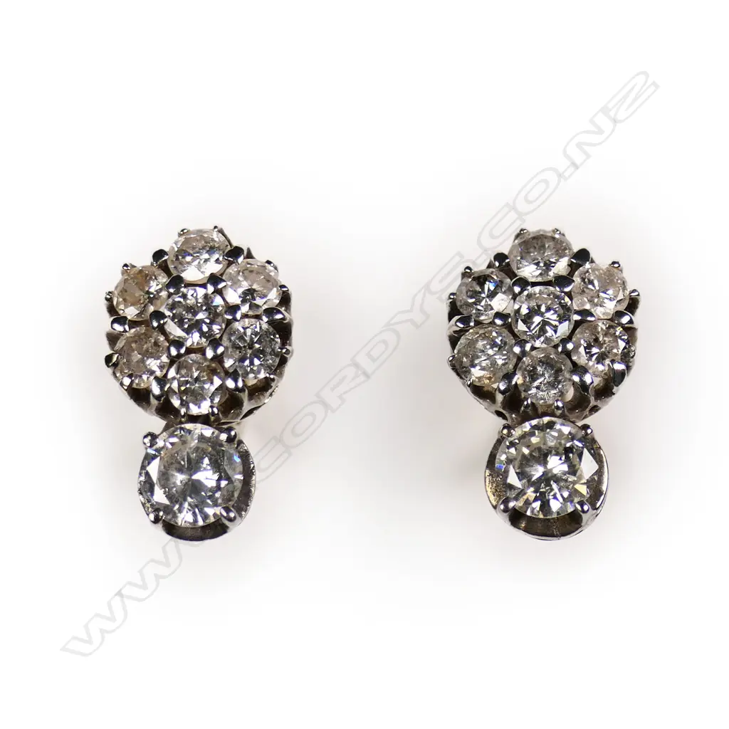 A pair of estate 14ct white gold and diamond earrings, Image 1++