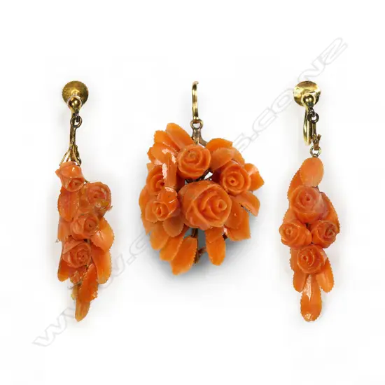 A 19thC 9ct gold and carved coral brooch and earring boxed set,