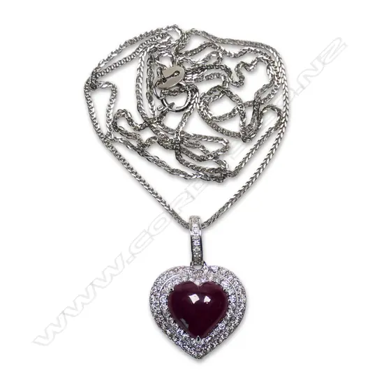 An 18ct white gold diamond and ruby pendant,