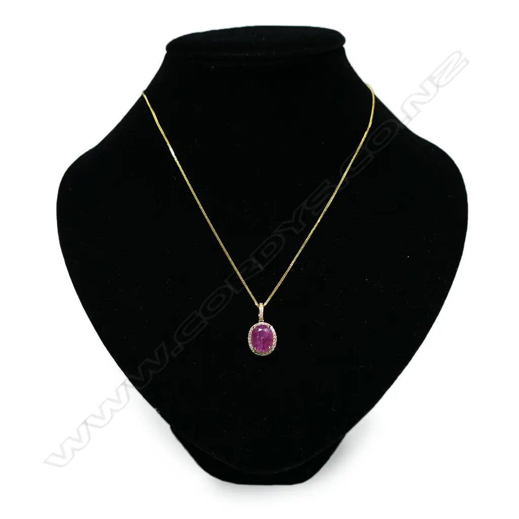 A 9ct gold ruby and diamond pendant, Image 1++
