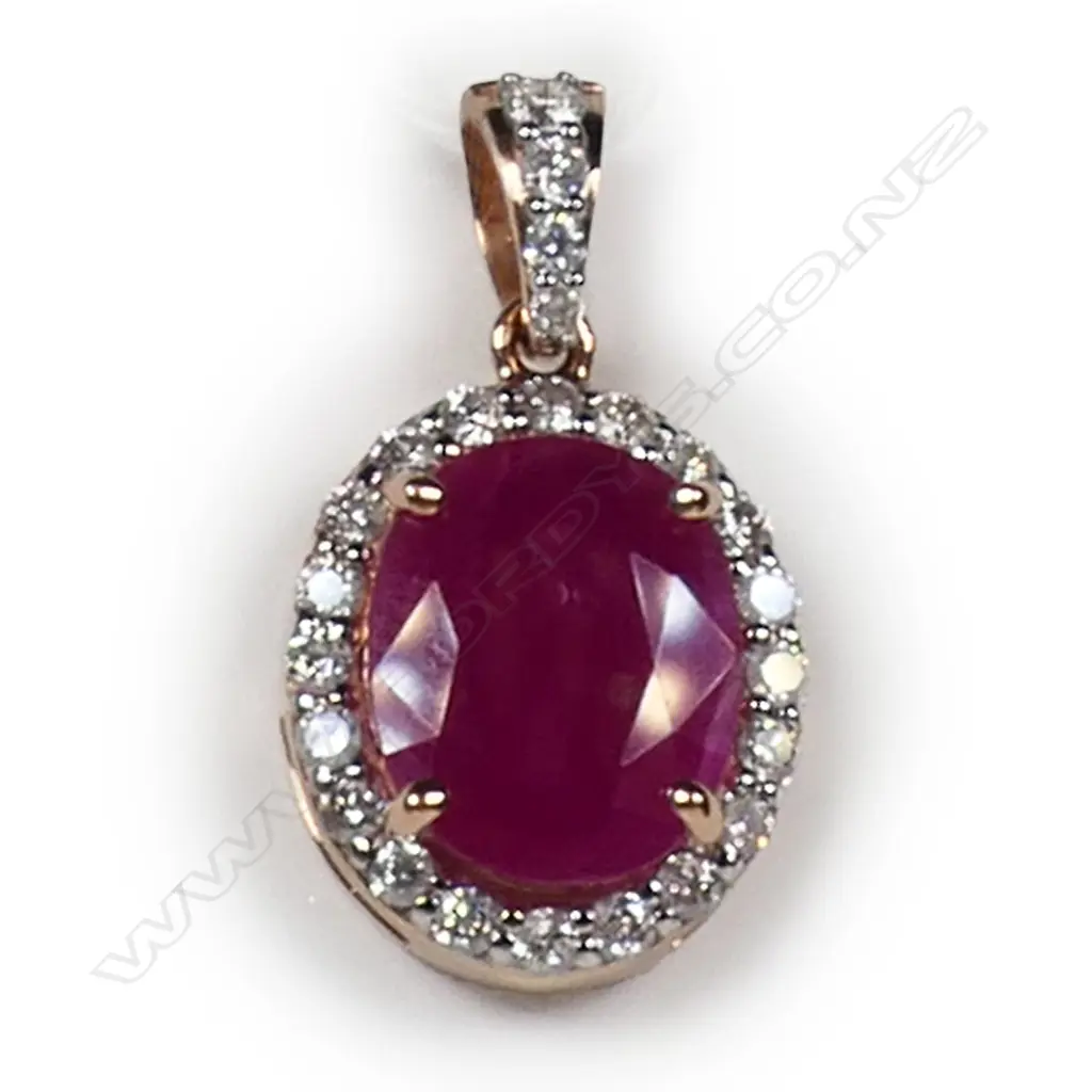A 14ct rose gold ruby and diamond halo pendant, Image 1++