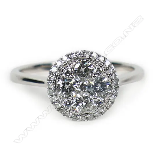 An 18ct white gold and diamond cluster ring,