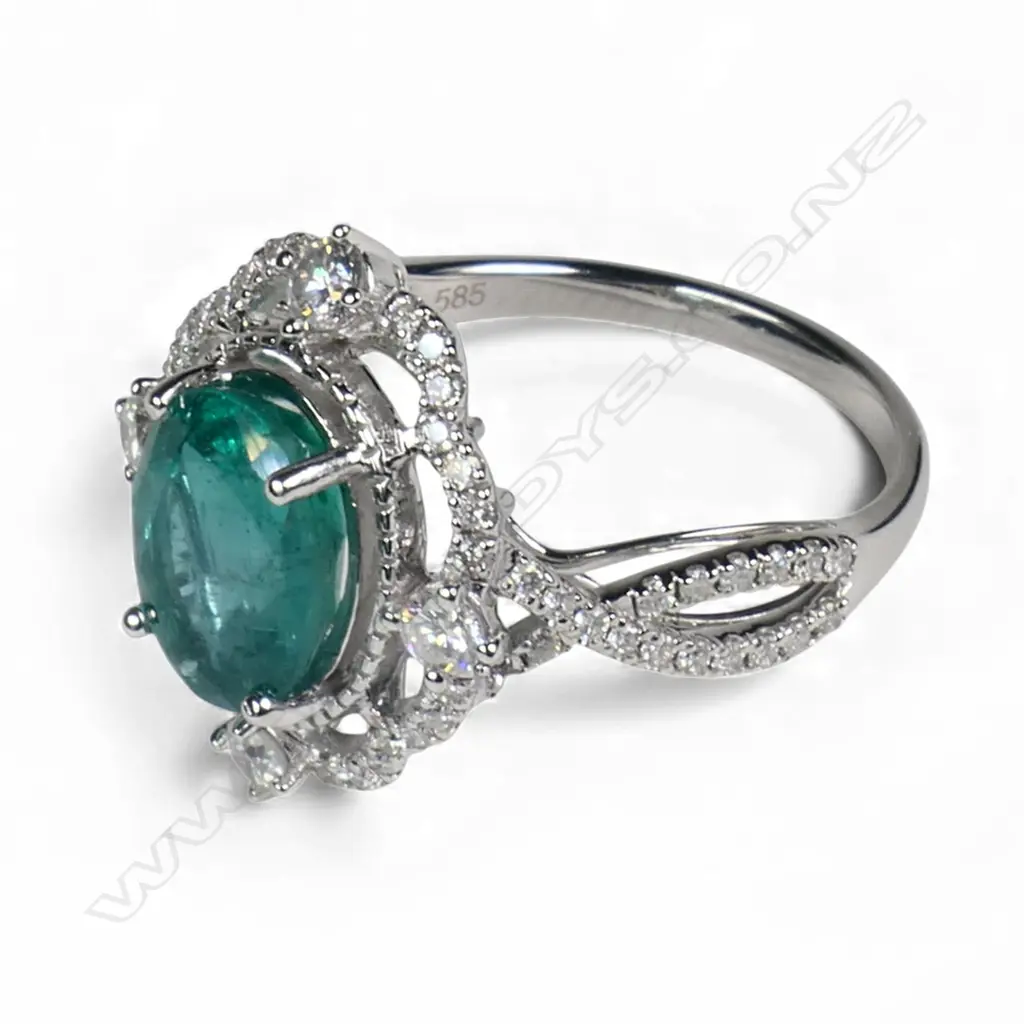 A 14ct white gold emerald and diamond ring, Image 1++