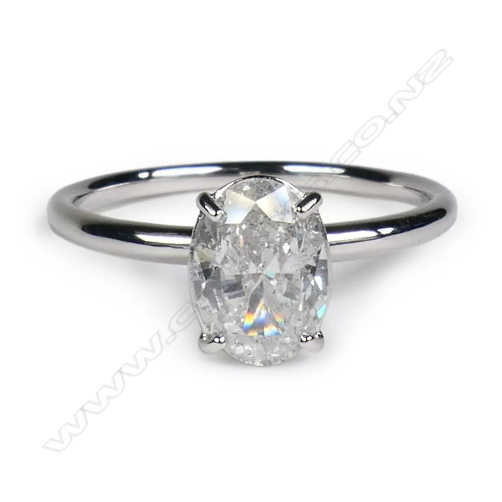 A 14ct white gold and diamond solitaire ring, Image 1++