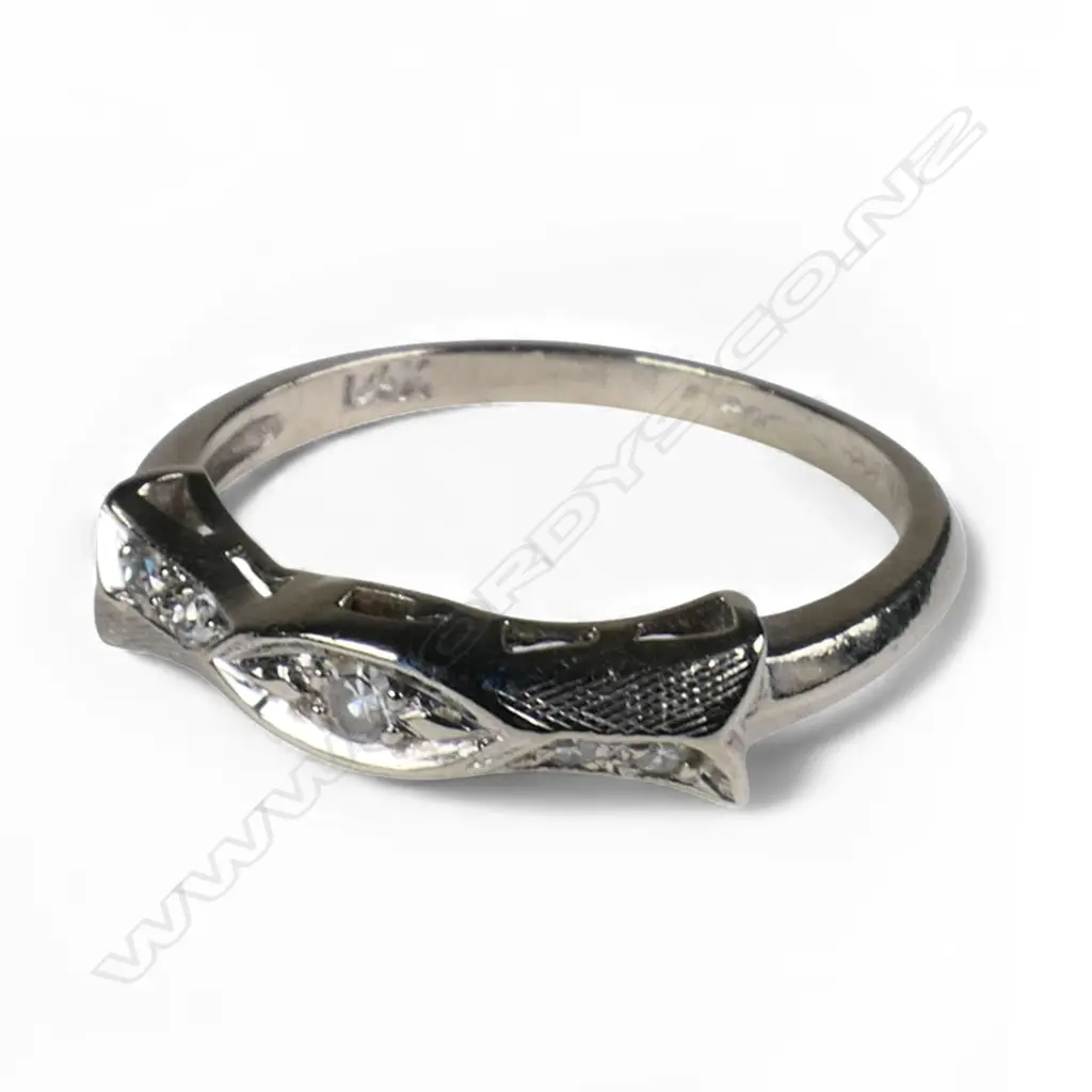 A 14ct white gold and diamond band ring, Image 1++