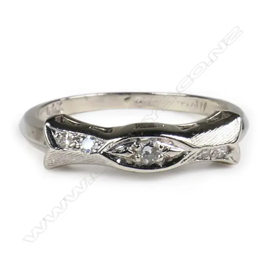 A 14ct white gold and diamond band ring,