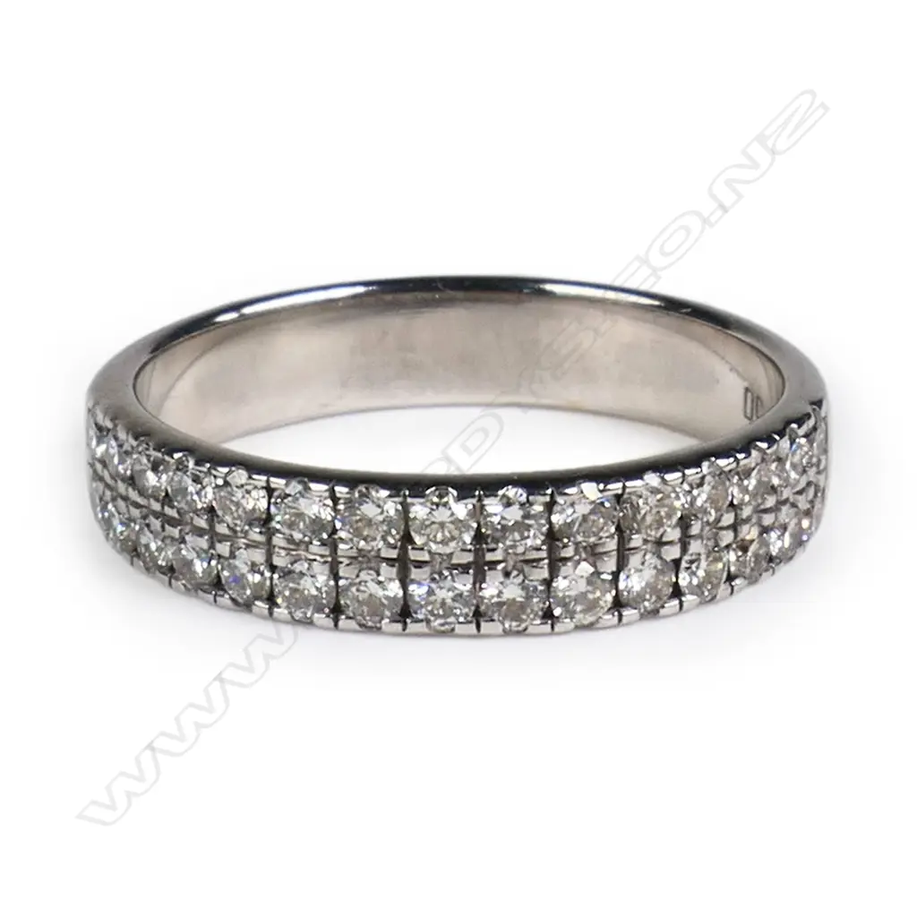 An 18ct white gold and diamond band ring, Image 1++
