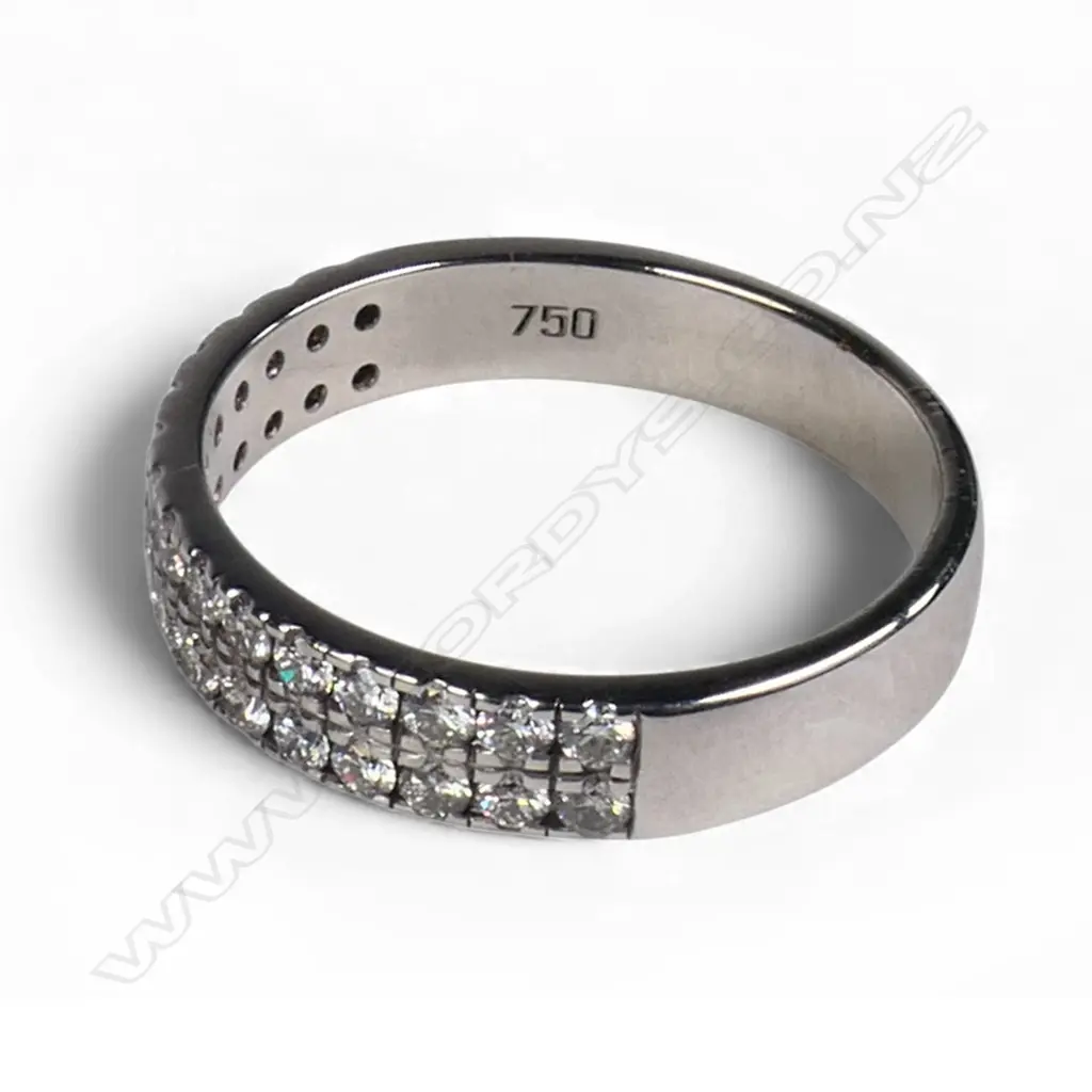 An 18ct white gold and diamond band ring, Image 1++