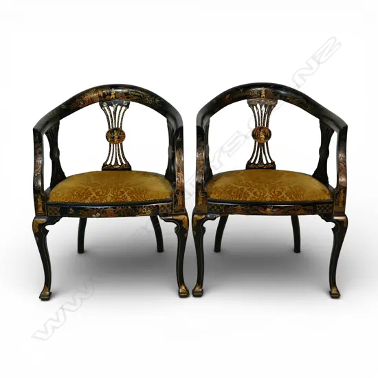 A pair of ebonised open elbow armchairs,