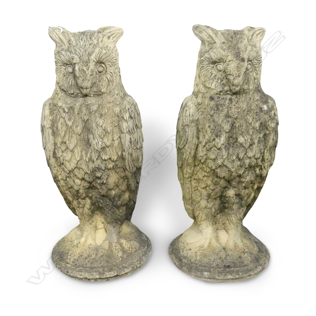 A pair of classical Church Stone owl garden ornaments, standing on circular bases. H.670mm. Image 1++