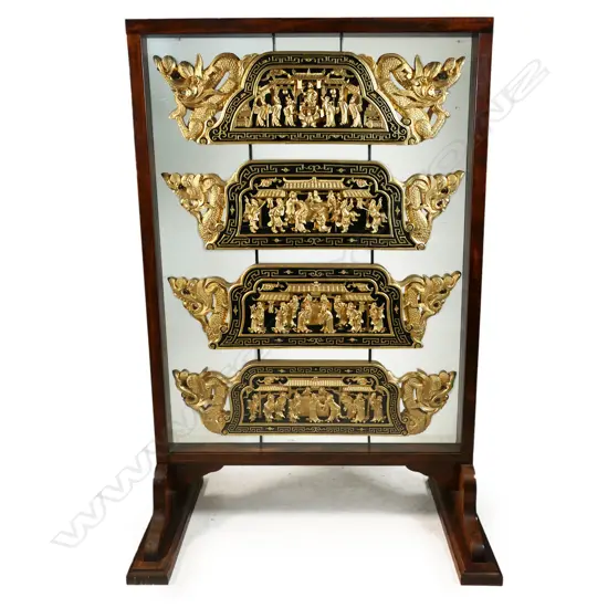A Chinese set of four carved and gilt panels framed as a room screen,