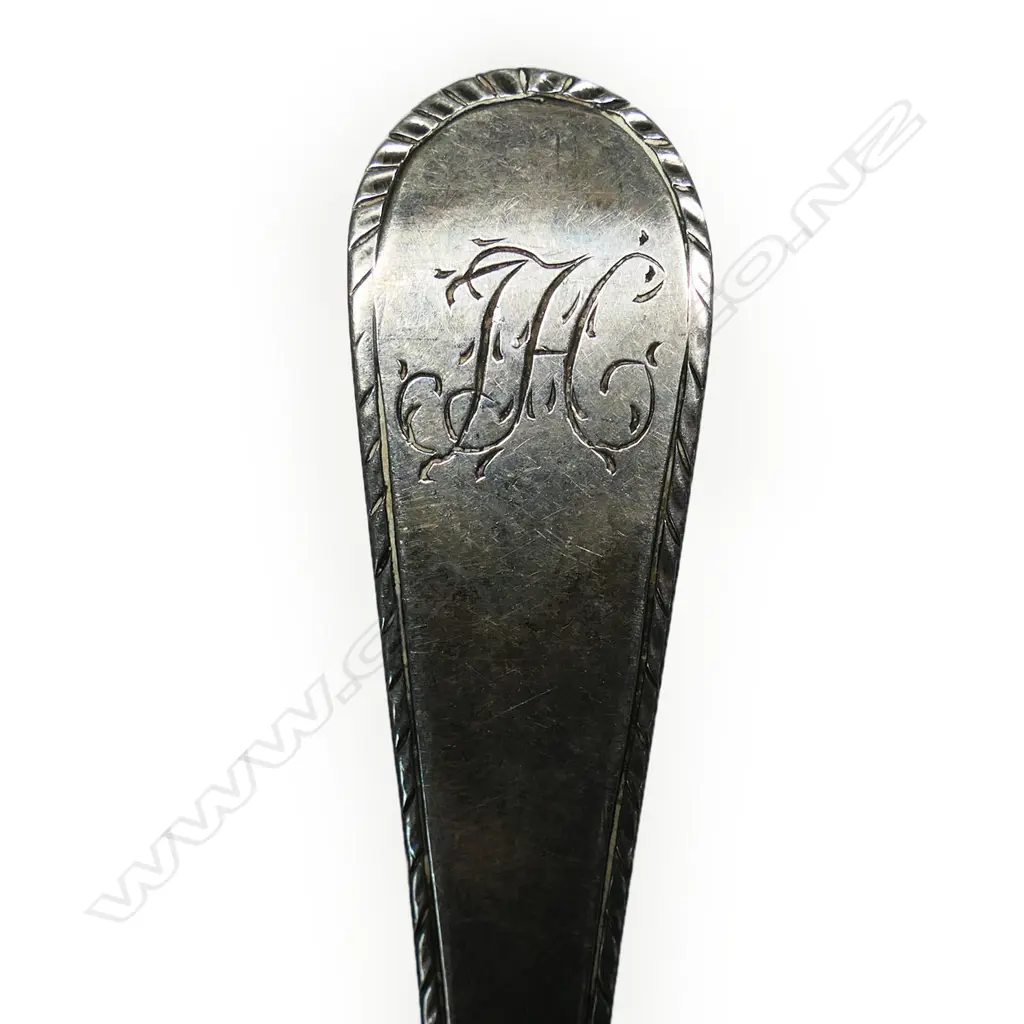 A George III silver feather edged table spoon, Image 1++