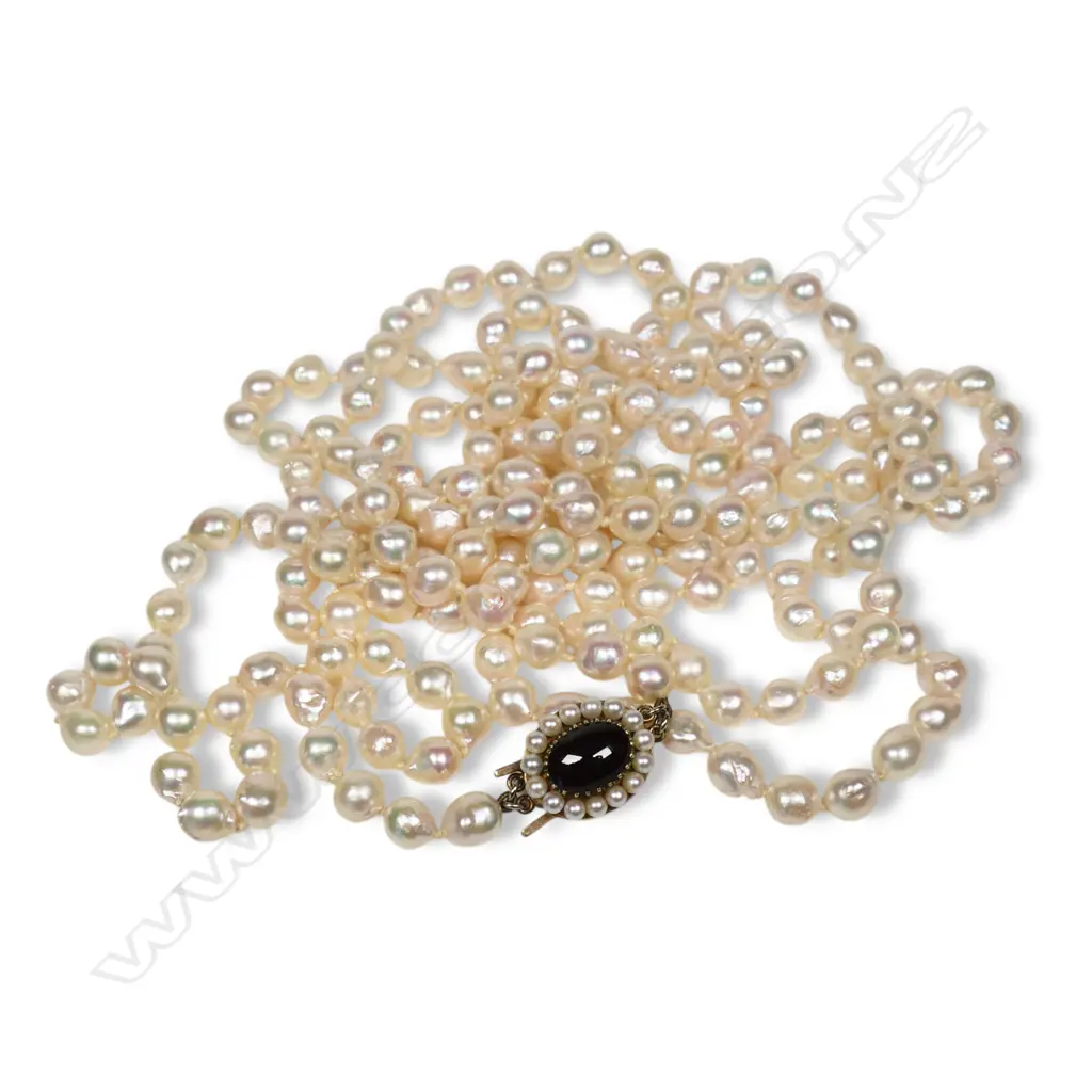 An opera length (70") semi baroque pearl necklace, Image 1++