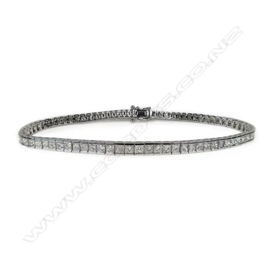 An 18ct white gold and 73 diamond tennis bracelet,