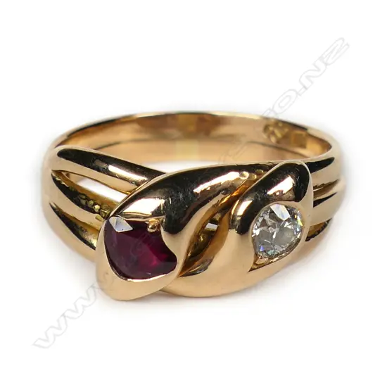 An 18ct rose gold diamond and ruby double headed snake ring,