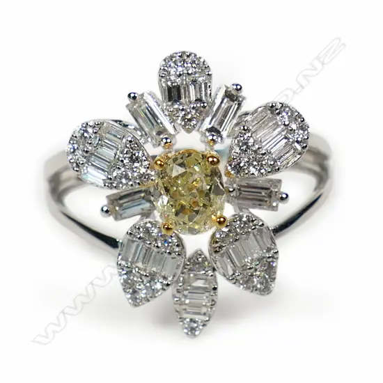 A contemporary 18ct white gold yellow and white gold cluster ring,