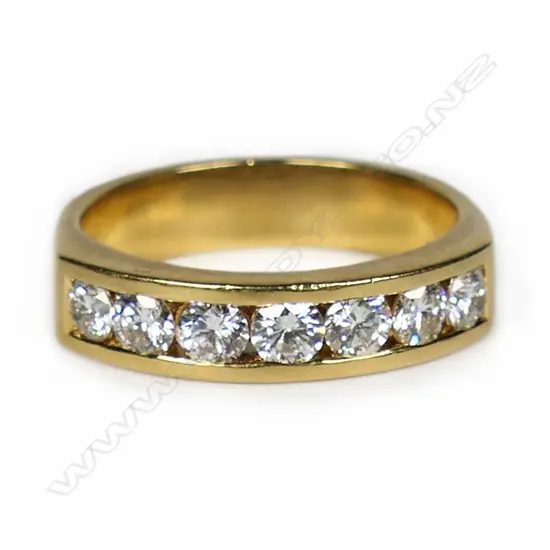 An 18ct gold and diamond set band,