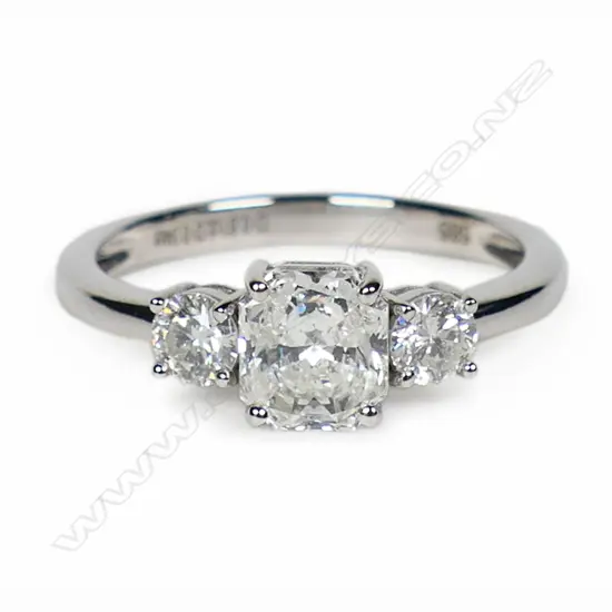 A 14ct white gold and diamond trilogy ring,