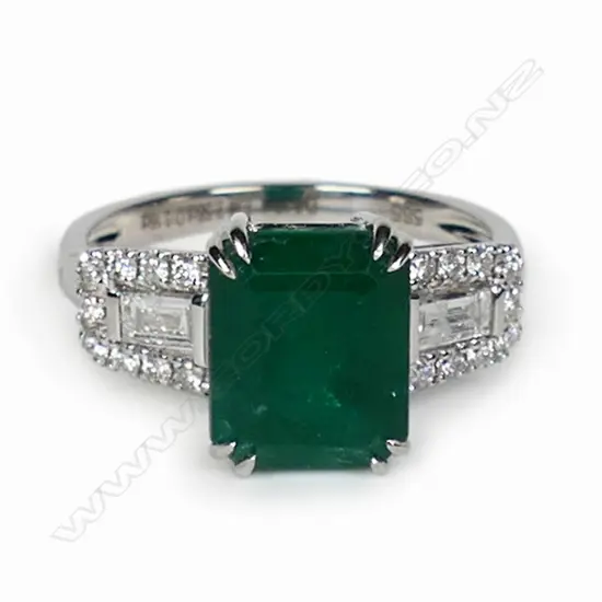 A 14ct white gold emerald and diamond dress ring,