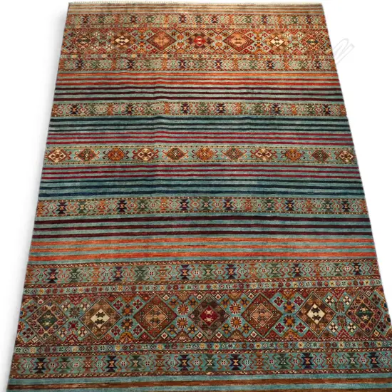 A hand-knotted Khurjeen carpet,