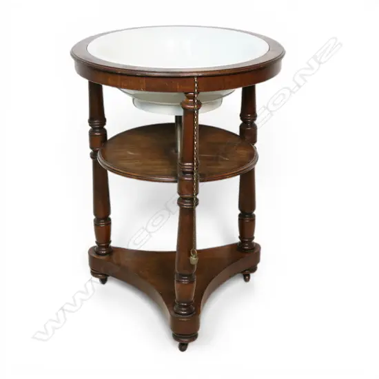 An early 19thC mahogany circular wash stand,