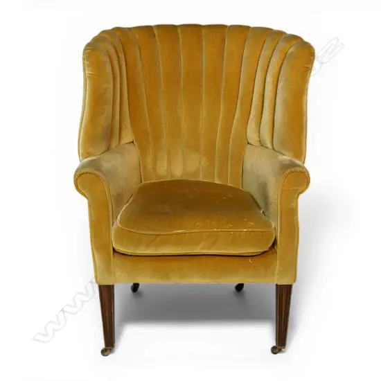 An Edwardian high lobed back and curved back parlour chair,