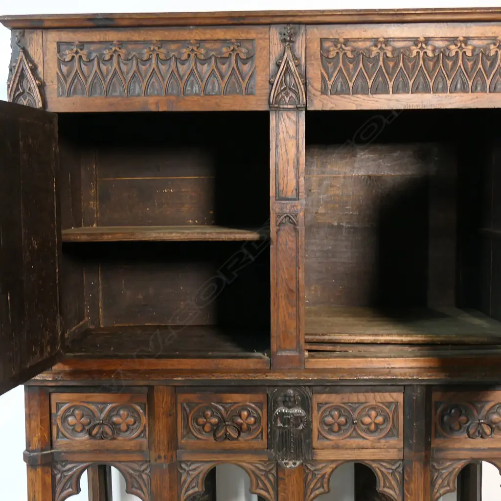 An uncommon and very decorative 19thC oak carved ecclesiastical carved cupboard on raised stand, Image 1++