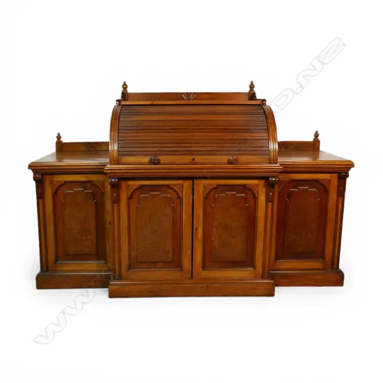 An uncommon New Zealand colonial rimu tambour top desk,