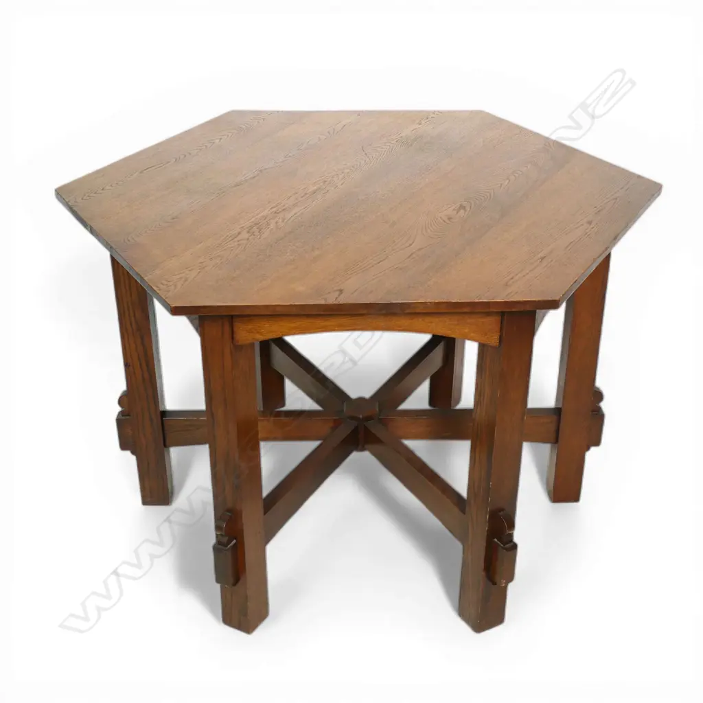 An uncommon Arts & Crafts oak hexagonal table and six shaped chair set, Image 1++
