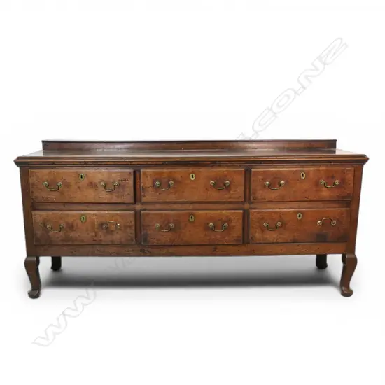 A George III country oak dresser base,