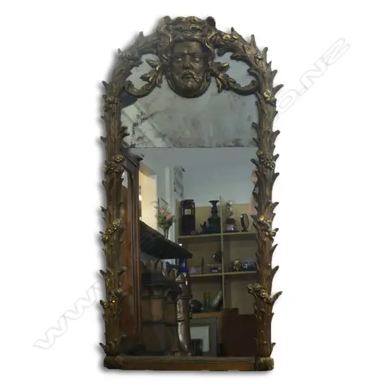 An 18thC European style early 20thC ornate gilt wall mirror,