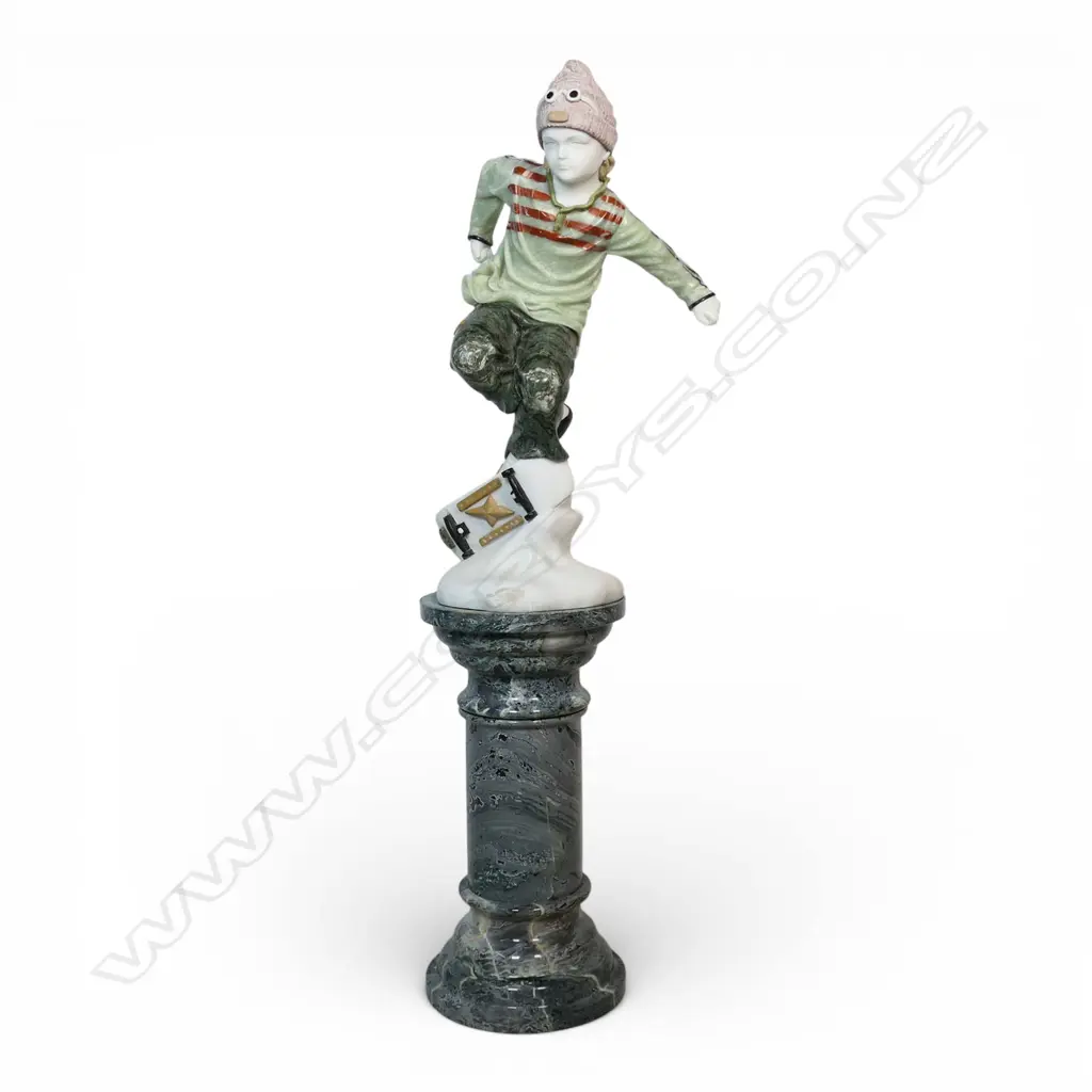 A carved coloured marble sculpture of a skateboarder, Image 1++