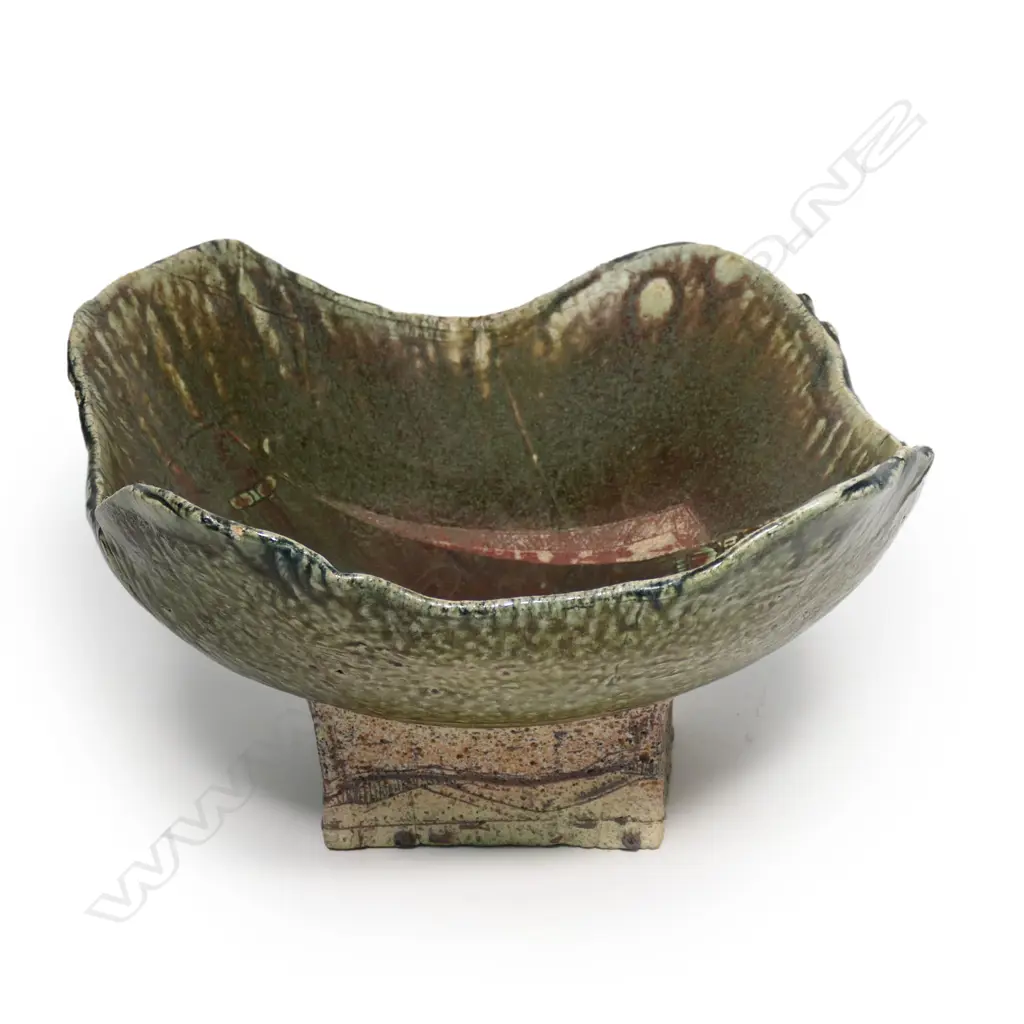 George Kojis (USA/NZ. 1942-) large stoneware square footed dish. Incised decoration. Red & green. 420 x 385 x 230mm. Provenance: From the collection of Elaine Jakobsson (Christchurch, previously Eastbourne, Wellington) a respected poet and author with work published under her pen name Helen Jacobs. Image 1++