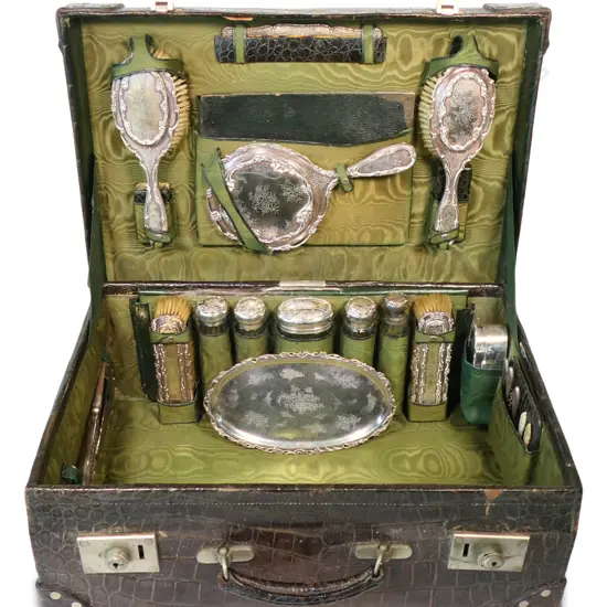 An impressive Edwardian crocodile skin travelling dressing case,