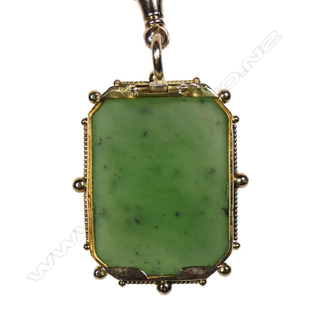 A vintage gold framed pounamu pendant with attached clip, Image 1++