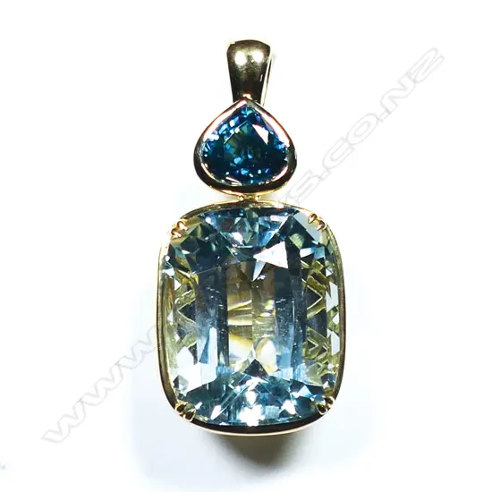 A large 18ct gold aquamarine and Canadian zircon pendant ,