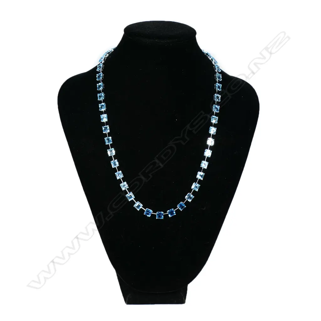 A 9ct white gold and blue topaz necklace, Image 1++