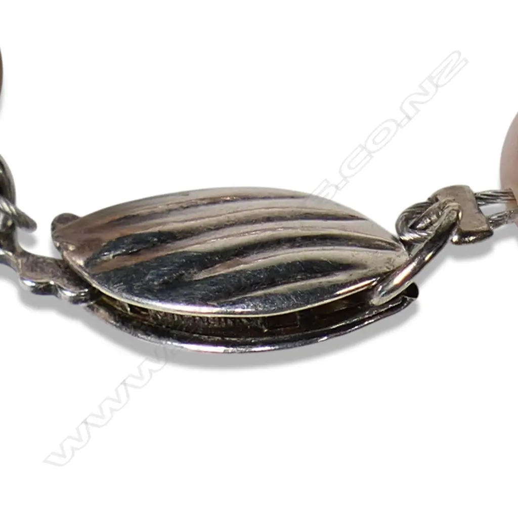 A cultured freshwater peach pearl necklace with platinum, sapphire and diamond set bar, Image 1++