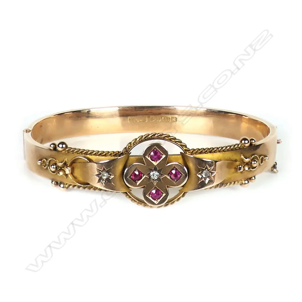 A early 1900s 9ct rose gold diamond and ruby bangle, Image 1++