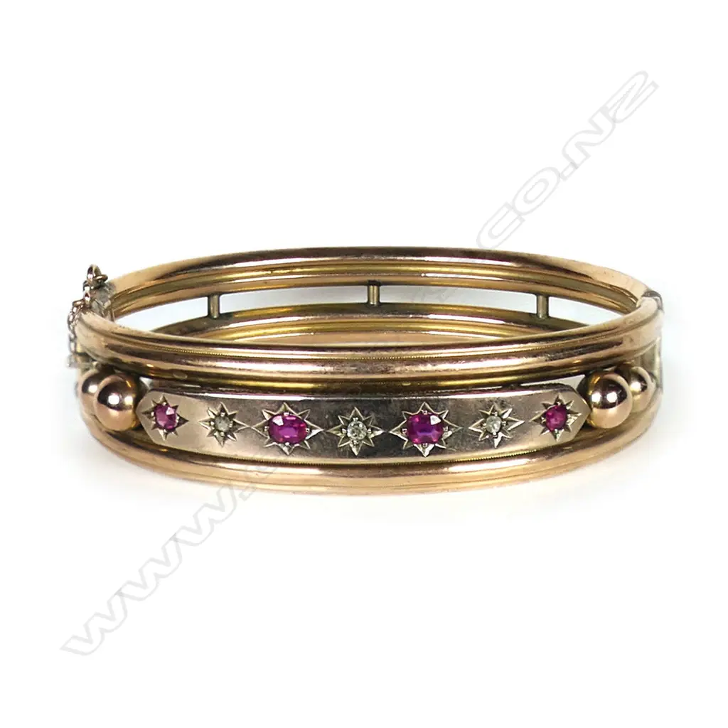 A 9ct gold Edwardian ruby and diamond bangle, Image 1++